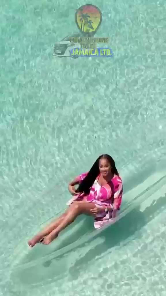 Guest floating on clear water in Jamaica