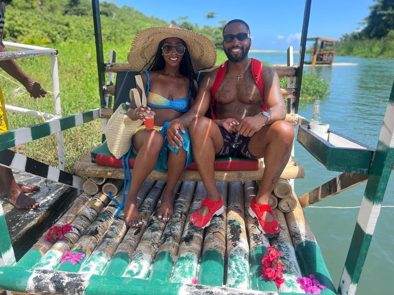 Couple on a bamboo raft booked with MG Adventure Tours
