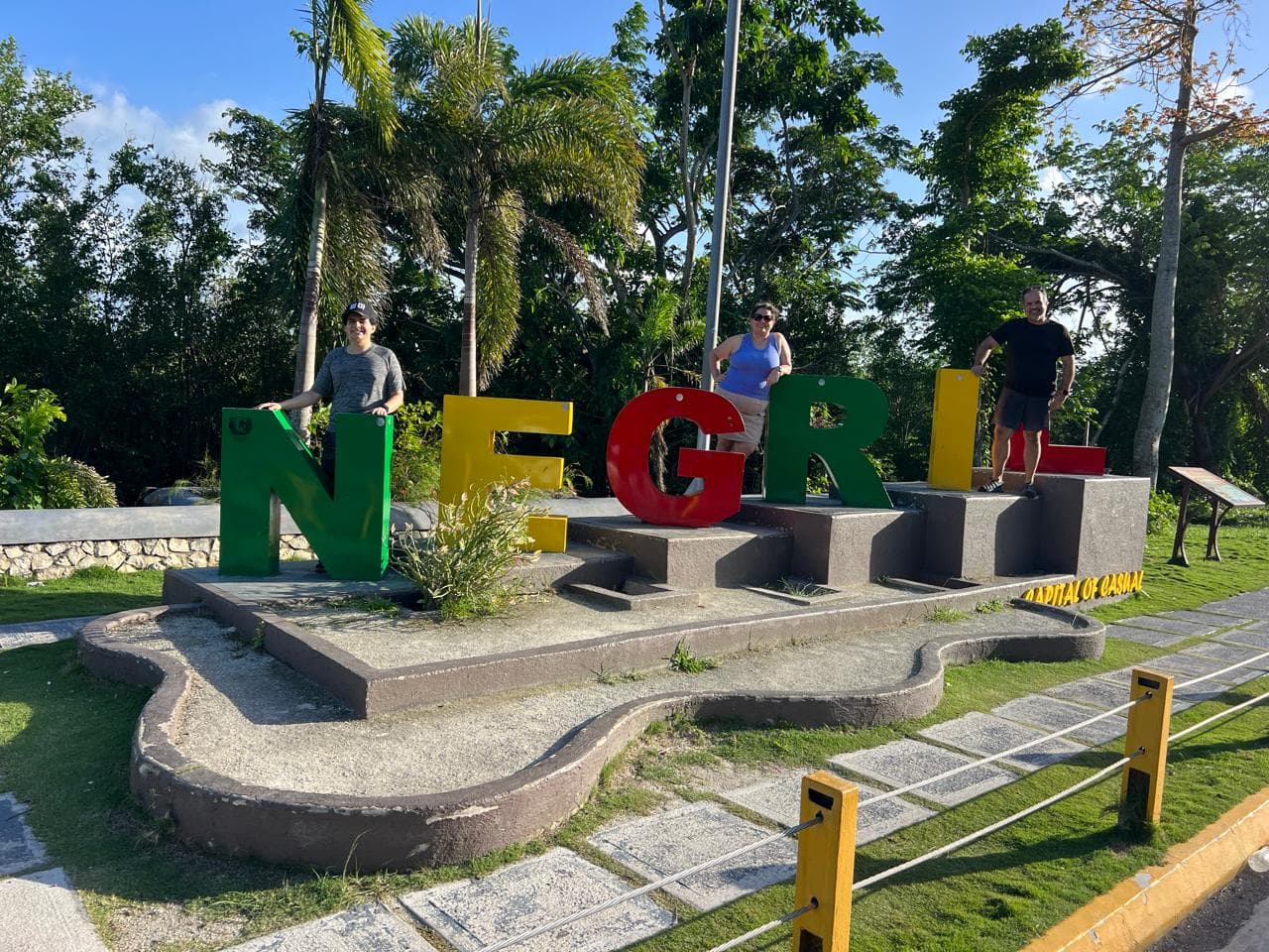 Guests at the colourful Negril letters lookout